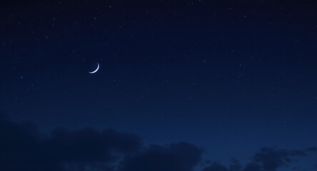 Crescent moon illuminates night sky over tranquil landscape astrophotography evening serene viewpoint nature's beauty