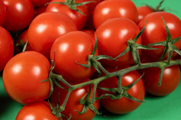 Close-up of a group of fresh whole cocktail tomatoes.
