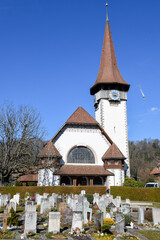 View at cementery and church of Spiez in the Swiss alps