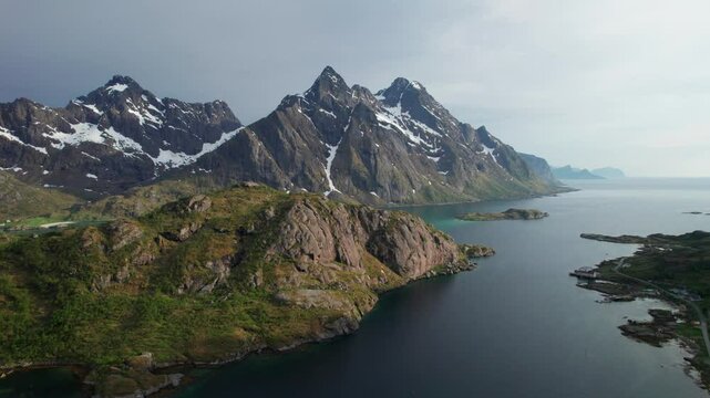 Breathtaking aerial view of the Lofoten Islands' rugged peaks, serene fjords, and verdant landscapes from the Sortland Steinsfjorden Viewpoint