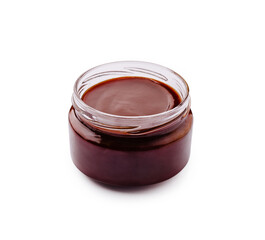 Chocolate sauce in a glass jar on a white background for dessert