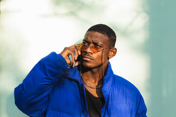 Portrait of handsome african american man using his mobile