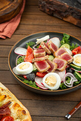 Portion of gourmet nicoise salad with tuna fish and eggs