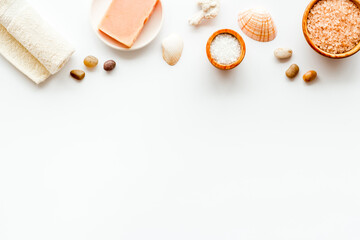 Essential oil and spa cosmetic products with sea shells, top view. Beauty spa therapy cosmetics and wellness background