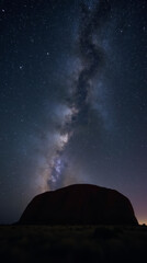 Uluru Ayers Rock in Australia Beneath a Star-Filled Night Sky with the Milky Way