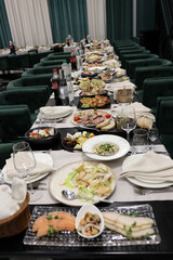 Festive table setting. Dishes and various dishes.