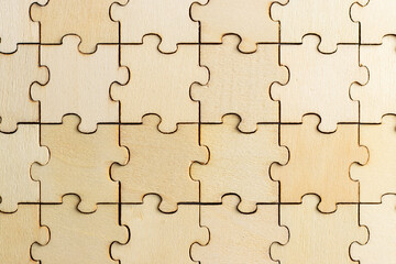 close up of plain wooden jigsaw puzzle