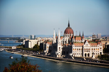 Naklejka premium View landscape and cityscape of Budapest old town city and Hungarian Parliament with tour cruises in Danube Delta river and Budapest Chain Bridge in Budapest, Hungary