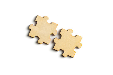 wooden jigsaw puzzle pieces isolated on white background.