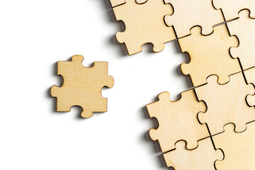 Obraz premium incomplete puzzle pieces, with seperated final pieces. Work and business concept with white background.