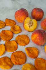 Peach and dried peach on a white background