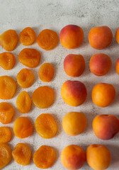 Apricot and dried apricot on a white background