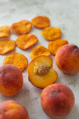 Peach and dried peach on a white background
