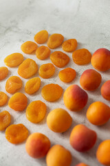 Apricot and dried apricot on a white background