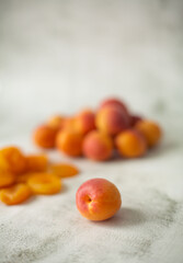 Apricot and dried apricot on a white background