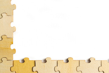 blank empty white space with wooden jigsaw puzzle frame. empty space for copy spaces.