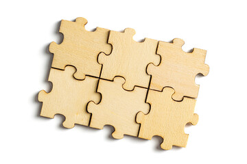 Fototapeta premium Wooden jigsaw puzzle pieces isolated on white background.