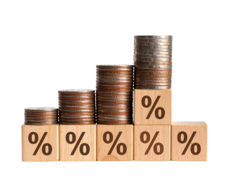Stacked coins on wooden blocks with percentage symbols form a rising bar graph, symbolizing financial growth or interest rates.