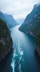 Norwegian Fjord with Waterfall-Fed River Flowing into Dramatic Steep Cliffs
