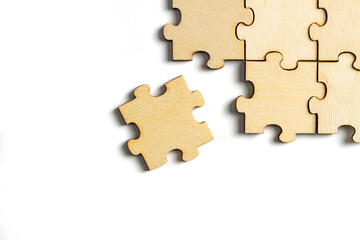 incomplete puzzle pieces, with seperated final pieces. Work and business concept with white background.
