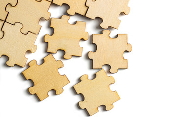 Incomplete wooden jigsaw puzzle on white background. 
