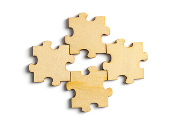 wooden jigsaw puzzle pieces isolated on white background.