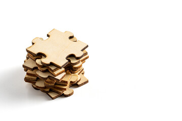 stack or piles of wooden jigsaw puzzle. empty space for copy spaces. on white background.