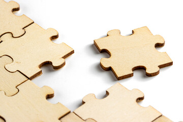 incomplete puzzle pieces, with seperated final pieces. Work and business concept with white background.