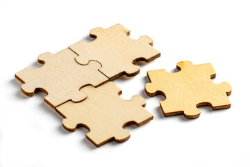 incomplete puzzle pieces, with seperated final pieces. Work and business concept with white background.