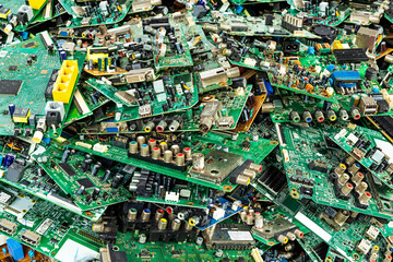 Pile of electronic waste from computer motherboards - old TV circuit boards from the recycling...