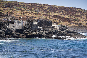 Waves hitting volcanic shoreline