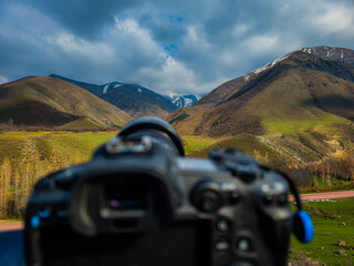 Camera capturing serene mountainous landscape during daytime