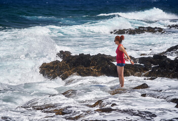 Fototapeta premium Happy woman enjoying the waves