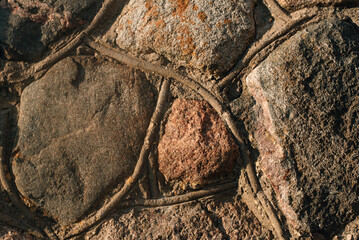 Old masonry wall made of large stones