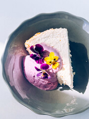 Cottage cheese casserole with blueberry yogurt and edible flowers

