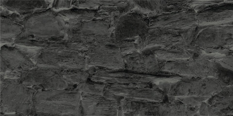 Textured stone wall background in monochromatic gray tones illustrating weathered and aged construction detail
