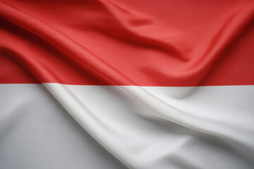 Fototapeta premium The Indonesian flag waves gracefully, showcasing its vibrant red and white colors in a captivating display of national pride and identity.