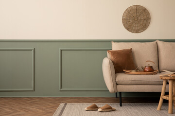 Creative composition of living room interior with copy space, beige sofa, green wall with stucco,...