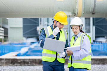 Engineer working at high voltage power substation infrastructure inspection check with safety...