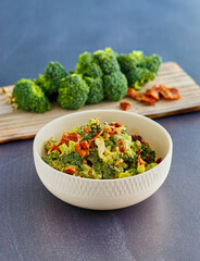 bacon and broccoli salad served in a white bowl