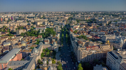 Urban Bucharest with tree-lined avenue and sunset lighting