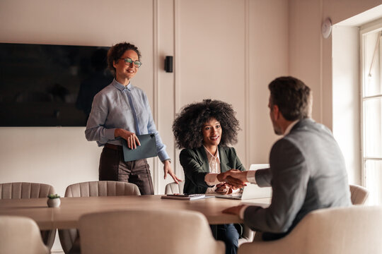 Professional Business Meeting With Handshake in Bright Office Setting