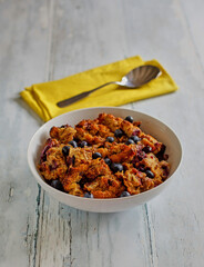 blueberry bread pudding topped with fresh blueberries