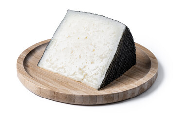 Close-up of a wedge of semi-cured cow's cheese isolated on white background