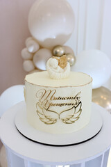 A beautiful cake with an angel for a baptism.