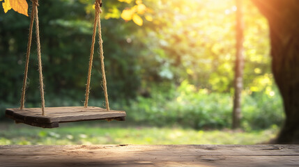 Empty wooden swing in warm sunlight in forest, tranquil nature escape scene