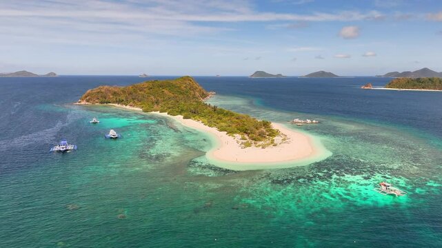 Bird's-eye survey of Manlihan Island, stunning paradise with tranquil water in Linapacan, Philippines