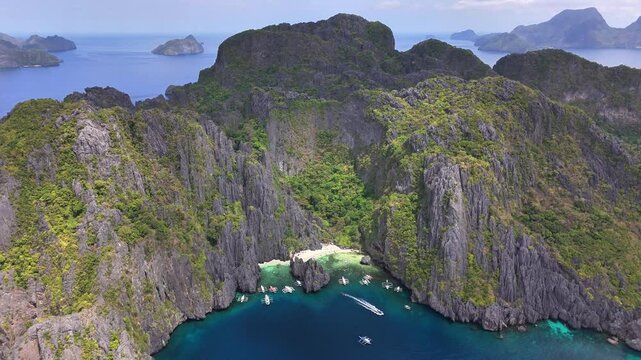 Impressive Aerial perspective of the Secret Lagoon at Jiji's Beach, Miniloc Island, Philippines