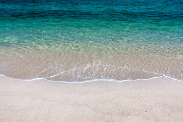 Crystal-clear emerald colored sea meets pristine sandy beach. Koh Adang, Thailand. Beautiful see background.