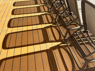 Shadows of sun loungers on the deck of a cruise ship